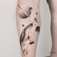 a black and white photo of a person's legs with tattoos on them,