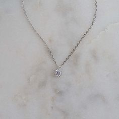 This delicate necklace featuring a tiny bezel pendant is a must-have staple piece! It is great for layering, but also adds a sweet minimalist touch to any look/outfit. Dress it up or down, you just can't go wrong with this piece! Made of 925 Sterling Silver We use a THICK, DURABLE 14k Gold or Rhodium plating for a piece that will last you years to come! Available in 16" + 3" Extension Chain Nickel-free & Hypoallergenic Bezel Necklace, Bezel Pendant, Outfit Dress, Delicate Necklace, Staple Pieces, Rhodium Plated, Silver Necklaces, Layering, Silver Necklace