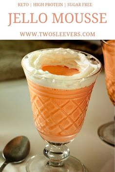 an orange dessert in a glass with whipped cream on top and the words jello mousse above it