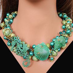 "Make a splash with our Sea Life Statement Necklace! Each hand-painted piece features gemstones, pearls, and crystals, all set in hypoallergenic, nickel-free wire (so no itchy reactions). Available in gold or silver, each necklace is one-of-a-kind, just like you. Dive into style with our unique 17" x 1.1" with 3 inches extender necklace! Unique Turquoise Czech Glass Jewelry, Ocean-inspired Green Beaded Jewelry, Whimsical Jewelry With Lobster Clasp For Jewelry Making, Artistic Turquoise Jewelry With Unique Variations, Hand Painted Turquoise Elegant Jewelry, Elegant Hand Painted Turquoise Jewelry, Hand Painted Czech Glass Jewelry For Gift, Hand Painted Czech Glass Jewelry Gift, Hand-painted Czech Glass Jewelry Gift