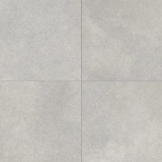 a white tile floor with four squares in the middle