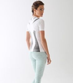 Functional White Activewear For Pilates, White Compression Top For Pilates, Supportive Functional Tops For Yoga, Supportive Functional Yoga Tops, Functional White Tops With Light Support, White Functional Tops With Light Support, Modern Stretch Activewear For Training, Supportive White Workout Top, Compressive Functional Tops Squat Proof