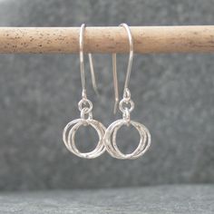 These sterling silver earrings have three interlinked circles hanging freely from the bottom of the ear wires.  They would make a lovely anniversary gift or birthday gift for a friend.  Material - sterling silver  Dimensions - circle diameter of approximately 10 mm, total drop of approximately 35 mm  Delivery - FREE UK delivery via Royal Mail  Please read the 'Description' section for more information. Russian Wedding Ring, Russian Wedding, Silver Circle Earrings, Copper Jewellery, Hoop Earrings Silver, Three Rings, Sterling Silver Hoop Earrings, Sterling Silver Hoops, Retail Therapy