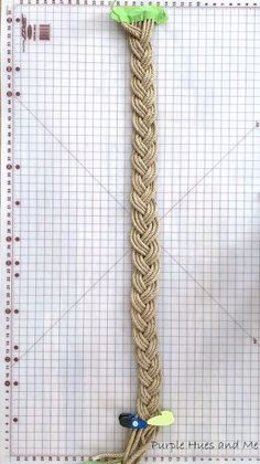 a piece of rope that has been made to look like a long, braided pole