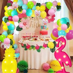 a birthday party with balloons and decorations