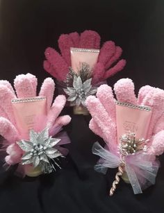 three pink and silver hair accessories on display