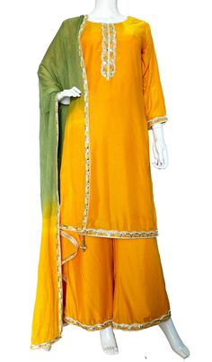 Mustard Yellow Muslin Flared Palazzo suit *Straight kurta(Top) with embroidery detailing on neck , sleeves  and hem(daman) .  *Wide leg palazzo pant with half elastic band and enough flare making it easy breezy. Embroidery at hem all around. *Hand dyed pure chinon shaded two color dupatta with matching tassels and a beautiful embroidery border Best for Indian weddings , Festivals, Navratri, Lohri, Diwali, Karwa Chauth, Pooja Dress, Mehndi, Haldi Ceremony, Henna Night and jaago events. WashCare: Semi-stitched Orange Palazzo Set With Gota Work, Traditional Orange Palazzo Set With Gota Work, Traditional Orange Palazzo Set With Zari Work, Orange Palazzo Saree Set For Diwali, Orange Semi-stitched Palazzo Set For Navratri, Orange Cutdana Palazzo Set For Festivals, Semi-stitched Traditional Silk Palazzo Set, Traditional Semi-stitched Silk Palazzo Set, Orange Palazzo Set With Zari Work And Straight Kurta