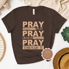 Shop this beautifully designed Pray Christian Shirt Today. Our Faith TShirt is soft and comfy. You won't want to take it off. This religious Tshirt would make the perfect gift for woman of God.  It is made with 100% ring-spun cotton. Available in sizes S-3X Unisex sizes.  UNISEX FIT offers a relaxed fit that works well for women and men. TIP: Choose a size down in Unisex if you prefer a more fitted silhouette (e.g., if you are a Ladies XL, choose Unisex L) This is a must-have to be added to your Christian T Shirt Design Ideas, Christian T Shirt Ideas Women, Christian T Shirt Ideas For Men, Tshirt Print Ideas Graphic Tees Shirt Designs, Christian T Shirt Ideas, Christian Tshirt Design Ideas, Christian Shirt Designs, Church Shirt Designs, Kente Dresses