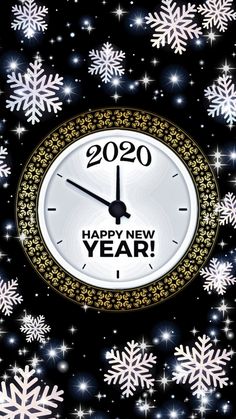 a happy new year clock surrounded by snowflakes