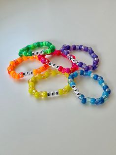 Celebrate your unbreakable bond with these vibrant, handcrafted BFF beaded friendship bracelets! Made with multicolored pony beads, each bracelet is a playful mix of bold colors that reflect the fun and joy of your friendship.  Whether you're celebrating a birthday, sending a little surprise, or simply showing your bestie how much they mean to you, these colorful beaded bracelets are the ultimate symbol of your forever bond! ✨ Key Features: - Multicolored pony beads for a bright, playful look - Colorful Friendship Bracelets With Beads, Colorful Plastic Beaded Friendship Bracelets, Friendship Beaded Bracelets With Letter Beads, Plastic Beaded Friendship Bracelets, Colorful Beaded Stretch Bracelet For Friendship, Personalized Multicolor Plastic Bracelets, Friendship Rainbow Beaded Plastic Bracelets, Rainbow Plastic Friendship Bracelets, Colorful Casual Friendship Bracelets With Letter Beads