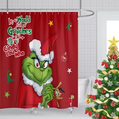 a christmas shower curtain with the grin on it's face next to a christmas tree