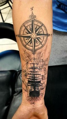 a man with a compass tattoo on his leg