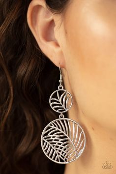 Featuring lifelike palm leaf patterns, a dainty silver frame connects to a larger silver frame, creating a whimsically stacked lure. Earring attaches to a standard fishhook fitting. Sold as one pair of earrings. Silver Dangle Earrings With Fish Hook, Silver Adjustable Fish Hook Earrings, Silver Leaf-shaped Jewelry With Ear Wire, Silver Leaf-shaped Metal Earrings, Adjustable Silver Leaf Jewelry, Silver Leaf-shaped Metal Jewelry, Silver Leaf-shaped Adjustable Jewelry, Palm Leaves Pattern, Leaf Patterns