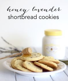 honey lavender shortbread cookies on a plate with a jar of honey in the background