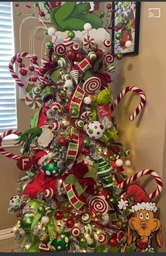 a christmas tree decorated with candy canes and ornaments