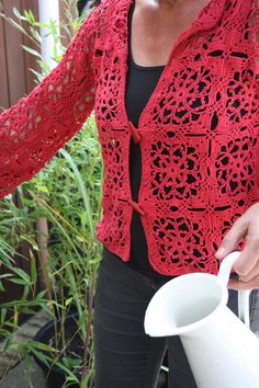 *material: 50% cotton - 20% silk - 25% polyamide *color: (pink) red *(approximately) sleeve length: 45 cm / sleeve width: 17 cm / armhole 20 to 22 cm / jacket length: 57 cm / width 50 to 55 cm *the pattern consists of squares crocheted together, which makes it a straight model. The elasticity of the model allows the vest to fold nicely around the body. The neck falls nicely open, because the points fold over. *closure with two luxurious buttons. *wash: by hand / max 30 degrees / little detergent Red Cotton Summer Cardigan, Red Crochet Long Sleeve Cardigan, Red Crochet Cardigan For Spring, Fitted Red Crochet Lace Top, Crocheted Squares, Rose Rouge, Fold Over, Pink Red, Clothing Items