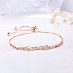 Fashion Element: Bow, Gang Drill Style: Simple Resizable Rose Gold Bracelet, Elegant Rose Gold Adjustable Bracelet, Adjustable Rose Gold Cubic Zirconia Chain Bracelet, Elegant Adjustable Rose Gold Bracelet, Elegant Rose Gold Bracelets For Gifts, Elegant Rose Gold Bracelet As Gift, Elegant Rose Gold Bracelet Gift, Rose Gold Bracelet Jewelry Gift For Her, Elegant Rose Gold Sterling Silver Bangle Bracelet