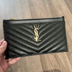 Authentic Saint Laurent Cassandra Mattelasse Zipped Pouch In Grain De Poudre Embossed Leather Brand New Barely Used (Put Items In Here Once Or Twice And Carried In A Brand New Purse). Some Light Makeup Stains In The Interior That Can Be Wiped Off. Great For Small Bills, Bank Cards, And Makeup. Does Not Fit Iphone 15 Pro Max Comes With Original Box And Dust Bag. Purchased From Neiman Marcus $525 Not Including Taxes. Saint Laurent Bill Pouch Wallet In Matelass Stitching Quilted, Glazed Powder-Grai Makeup Stain, Saint Laurent Bag, Light Makeup, Zip Pouch, Leather Pouch, Iphone 15 Pro, Embossed Leather, Calf Leather, Neiman Marcus