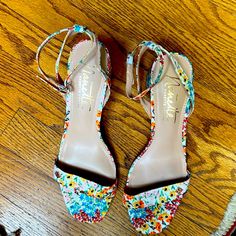 Nanette Lepore Fancy Shoes With Ivory Floral Fabric Colors Of Orange Yellow Red And Blue Including Heel. Six 7 With 2.5 Inch Heel. Like Brand New. Worn Once. I’m Excellent Condition. Very Comfortable And Will Match Any Colored Outfits Formal Floral Print Sandals For Spring, Fabric Heels With Ankle And Heel Straps, Spring Ankle Strap Fabric Sandals, Floral Print Heels For Spring Party, Spring Fabric Sandals With Heel Strap, Multicolor Floral Print Heels For Spring, Spring Heels With Floral Print And Ankle Strap, Spring Evening Heels With Floral Print, Spring Evening Floral Print Heels