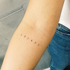 a woman's arm with the word faith written in cursive font on it