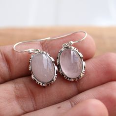 Gemstone - rose quartz Gemstone Size - 10x14 oval Metal - Sterling Silver Natural rose quartz sterling silver Earrings, Same design ring is also uploaded https://www.etsy.com/in-en/GemsNjewelrystudio/listing/752776088/rose-quartz-sterling-silver-ring-gift?utm_source=Copy&utm_medium=ListingManager&utm_campaign=Share&utm_term=so.lmsm&share_time=1600957399075 The earrings can be customized on request and the gemstone can be switched to any gemstone you want. Feel free to contact me Natural Stones Jewelry With Rose Quartz, Dainty Oval Jewelry With Natural Stones, Dainty Oval Natural Stone Jewelry, Dainty Silver Jewelry With Oval Cabochon, Dainty Silver Oval Cabochon Jewelry, Rose Quartz Jewelry With Natural Stones, Silver Dainty Oval Cabochon Jewelry, Pink Oval Jewelry Stamped 925, Dainty Oval Cabochon Jewelry