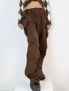 ⚡Buy 2023 Vintage Brown Baggy Parachute Cargo Pants Brown M under $44.00 in Pants at AnotherChill.com Online. Style: Casual/Street/Hip Pop/Punk/Y2K/Vintage. Fabric Content: Polyester Blend. Fit Type: Relax fit. : Step up your fashion game with these vintage-inspired parachute cargo pants. Perfect for festival seasons, these pants offer a relaxed fit and feature a drawstring detail at the waist and cuffs. Complete with functional pockets and a button zip fastening, they're a must-have addition to Cargo Pants Brown, Parachute Cargo Pants, Parachute Cargo, Drawstring Detail, Pants Brown, Pre Fall Collection, Bodycon Floral Dress, Pop Punk, Crop Top Blouse