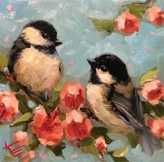 two birds are sitting on a branch with flowers