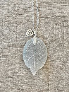 This detailed silver leaf necklace is the perfect gift to show how much you love someone one! This necklace is 18 inches long. The pendent is 3 inches tall and 1.5 inch wide. All products are made to order and may take 3-5 days to process before shipping. At this time I only ship within the United States. However, if you live outside the US and see something you are interested in let me know and I can work with you to create a custom shipping option. Nickel-free Leaf-shaped Silver Jewelry, Nickel-free Silver Leaf-shaped Jewelry, Silver Leaf-shaped Necklaces For Gift, Silver Leaf-shaped Necklace For Gift, Silver Leaf-shaped Necklace Gift, Nature-inspired Sterling Silver Leaf Necklace, Silver Leaf-shaped Necklace, Golden Heart, Resin Flowers