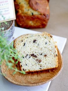 a piece of bread sitting on top of a wooden plate