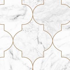 a white marble tile with gold accents