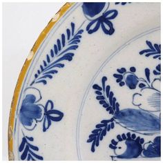 two blue and white plates with birds on them