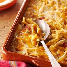 a casserole dish with chicken and cheese