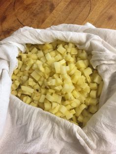 chopped potatoes in a paper bag on a wooden table