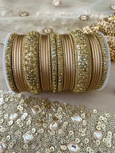 Indian Bangles Jewellery Metal Broad Kangan Karwachauth Navrati Bollywood Weddings Eid Diwali Parties. ⭐️ We often put videos and more images of these items on our Instagram page, please have a look  https://www.instagram.com/tohfaa_london/ Sizes - 2.4/2.6/2.8/2.10 2.4 is 2.25 inches 2.6 is 2.37 inches 2.8 is 2.5 inches 2.10 is 2.62 inches Other designs available please check my other listings! Material - Metal, Kundan, Rhinestone. Metallic finish bangles Set is for two hands. 13 bangles in each Gold Sets With Pallu For Navratri, Bohemian Jewelry With Zari Work For Festive Season, Festive Gold Sets With Stone Work, Bohemian Jewelry With Zari Work For Diwali, Diwali Gold Sets With Gota Work, Festive Gold Set With Pallu, Gold Gota Work Sets For Diwali, Diwali Gold Gota Work Sets, Gold Bollywood Sets For Diwali