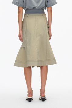 Cotton Work Skirt With Multiple Pockets, Cotton Workwear Skirt With Multiple Pockets, Cotton Cargo Skirt With Patch Pockets For Work, Chic Wrap Skirt With Pockets For Work, Spring Utility Relaxed Skirt, Utility Style Relaxed Skirt For Spring, Relaxed Utility Skirt For Spring, Chic Asymmetrical Wrap Skirt With Pockets, Asymmetrical Workwear Skirt With Side Pockets