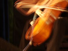 a blurry photo of a person playing an instrument