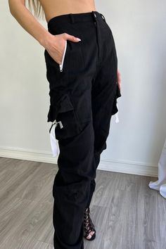 High waisted cargo pants with lace up detail Fits true to size 97% Cotton 3% Spandex Model is in size S. Height: 5'6" Bust: 32" Waist: 25" Hips: 35" Hip Hop High Waist Bottoms With Cargo Pockets, Hip Hop High-waist Bottoms With Cargo Pockets, Black Techwear Bottoms With Drawstring, Trendy Black Cargo Pants With Pockets, Spring Streetwear Cargo Pants With Belt Loops, Straight Leg Bottoms With Drawstring For Streetwear, Straight Leg Drawstring Bottoms For Streetwear, Spring Black Cargo Pants With Belt Loops, Black Cargo Pants With Belt Loops For Spring