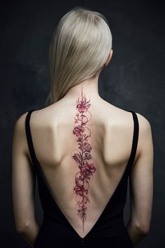 Discover the breathtaking world of spine tattoos for women, featuring unique and delicate designs that make a statement. From intricate red flowers to meaningful quotes and spiritual symbols, these tattoos are both elegant and personal. Consider the beauty of red and black combinations or the symbolism behind a dragon or butterfly, showcasing your individuality. Explore our collection to find the perfect spine tattoo that resonates with your style and spirit! Henna Spine Tattoos For Women, Spine Tattoos For Women Japanese, Spider Spine Tattoo, Floral Spine Tattoo Design, Spine Tattoos For Women Unique Red, Beautiful Spine Tattoos For Women Unique, Spine Tattoos Quotes, Red Spinal Tattoo Women, Big Spine Tattoos For Women