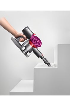 The Dyson V7 Motorhead cord-free vacuum has 75% more brush bar power than the Dyson V6 Cord-Free vacuum. Engineered for all floor types, the Direct-drive cleaner head drives bristles into the carpet to remove even more dirt. The Dyson V7 Motorhead cord-free vacuum quickly transforms to a handheld for quick clean ups, spot cleaning and cleaning difficult places. All Dyson official refurbished machines have been thoroughly tested to meet like-new performance standards. Units may have some cosmetic Hand Vacuum, Cordless Stick Vacuum Cleaner, Stick Vacuum, Cordless Vacuum, Handheld Vacuum, Quick Cleaning, Docking Station, Vacuums, Air Purifier