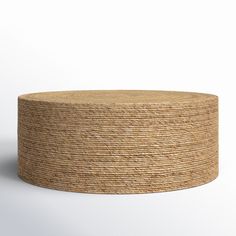 a round table made out of jute on a plain white background with shadow from the top