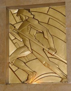 an art deco tile in the shape of a man on skis, with light coming from behind it