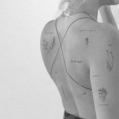 a woman with tattoos on her back