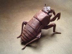 an origami insect sitting on top of a table