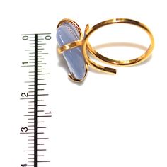 This chalcedony nugget ring is rustic and delicate! An adjustable gold vermeil four prong ring is adorned with a lovely lilac blue nugget of natural chalcedony . This ring is adjustable but is best for ring sizes between 5 and 8 1/2. Love! xoxoxo payton For more cool jewelry looks, check out http://www.etsy.com/shop/FizzCandy All FizzCandy creations come beautifully boxed and ready for gift giving. Please see our store policies here - https://www.etsy.com/shop/FizzCandy/policy?ref=shopinfo_polic Adjustable Gold Rings With Raw Stone, Adjustable Gold Chalcedony Jewelry, Handmade Gold Chalcedony Rings, Blue Chalcedony Ring, Cool Jewelry, Lilac Blue, Prong Ring, Chalcedony Ring, Modern Ring