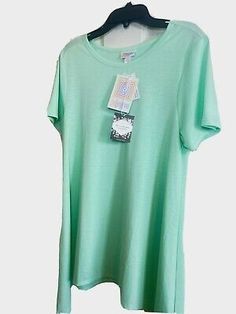 Lula Roe S Ladies shirt mint green $36 | eBay Light Green Short Sleeve Cotton Top, Light Green Cotton Short Sleeve Top, Light Green Short Sleeve Tops For Spring, Light Green Cotton Tops For Summer, Lula Roe, Ladies Shirt, Spandex Fabric, St Patricks, Womens Clothing Tops