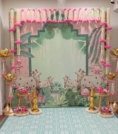 a decorated stage set up for a children's birthday party with pink and gold decorations