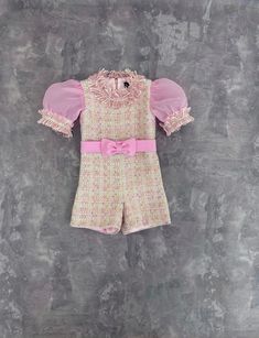 Light pink tweed girls pageant romper with organza sleeves/ Girls casual outfit/ Pageant casual wear/ Custom pageant outfit This beautiful romper is made out of high quality tweed. It has viscose lining. The romper has zipper back. It is easy to care and comfortable to wear. It looks amazing with matching organza sleeves. The romper is perfect for casual wear and other pageant events. It is absolutely stunning on!  Materials Tweed, satin, viscose, organza Colors and sizes The romper can be made in any color and size.  Message me and I'll happily send you a color chart. Offer more than 20 different colors to choose from.  All items are made to order.  Romper is tailored to order in any standard size.  The size chart is the picture of the listing. If you want it to fit perfectly send me plea Elegant Pink Short Sleeve Sets, Party Sets With Ruffles And Short Sleeves, Pink Ruffled Party Sets, Chic Pink Ruffled Sets, Chic Pink Set With Ruffles, Pageant Casual Wear, Pageant Outfits, Organza Sleeves, Pink Tweed