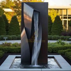 a water fountain in the middle of a garden