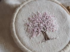 a close up of a small embroidered tree