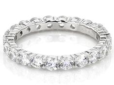 a white gold ring with five round cut diamonds on the inside and outside, set in 18k white gold